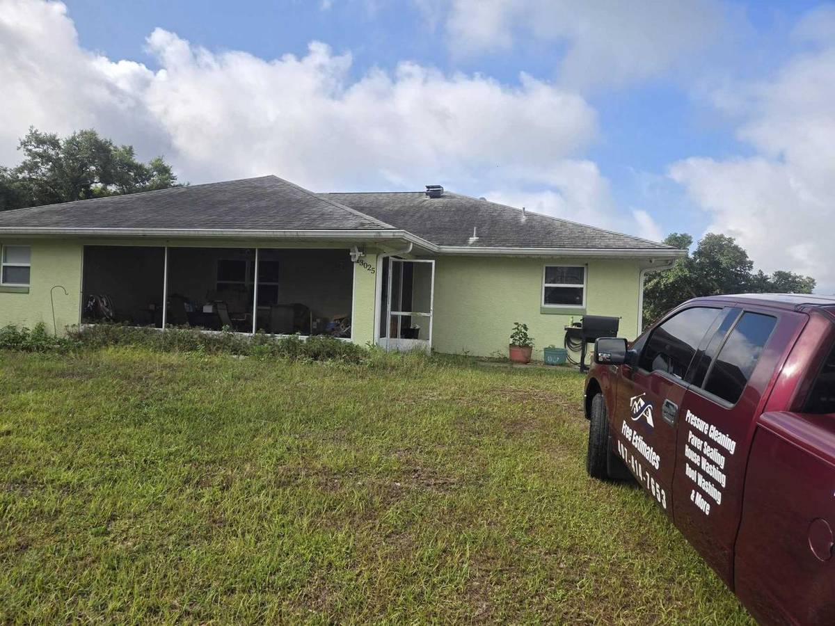 Clermont home exterior before cleaning
